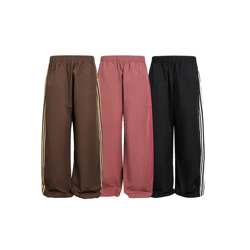 Damen weite Satin-Trainingshose mit elastischem Bund und seitlichen Kontraststreifen Nord Taschen
