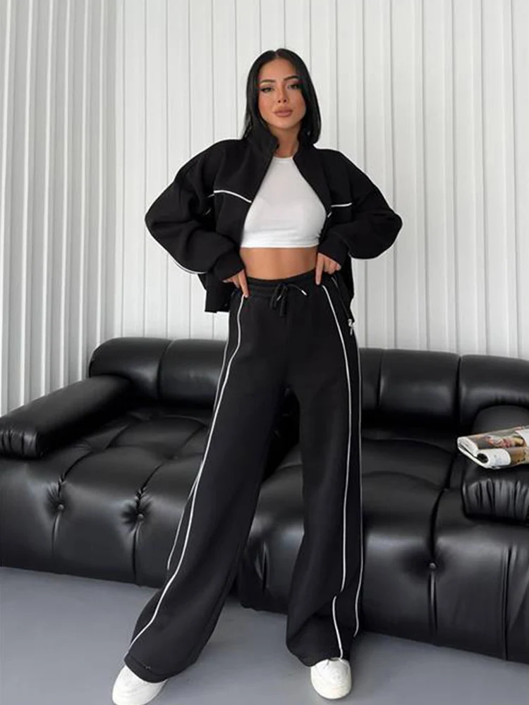 Damen lässiges Sweatset mit Stehkragen Reißverschluss gekürzter Jacke und hochtaillierter Schlaghose Nord Taschen