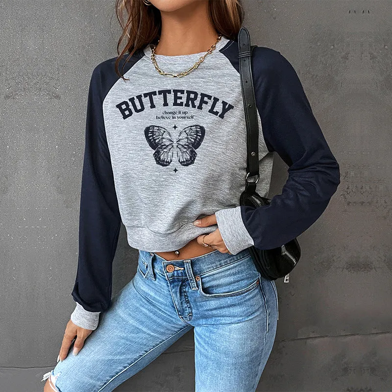 Damen Kurzes Raglan-Sweatshirt mit Schmetterlings-Print und kontrastierenden Ärmeln Nord Taschen