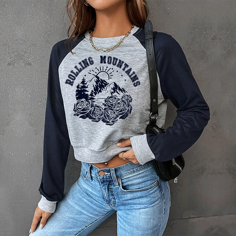 Damen Cropped Raglan-Sweatshirt mit Bergmotiv, gerafftem Saum und Kontrastärmeln Nord Taschen