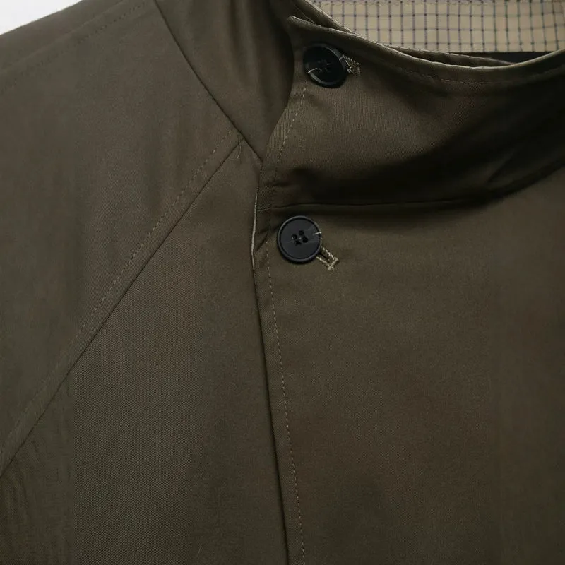 Damen kurzes Cape‑Mantel mit hohem Stehkragen, verdeckter Knopfleiste und Eingrifftaschen Nord Taschen