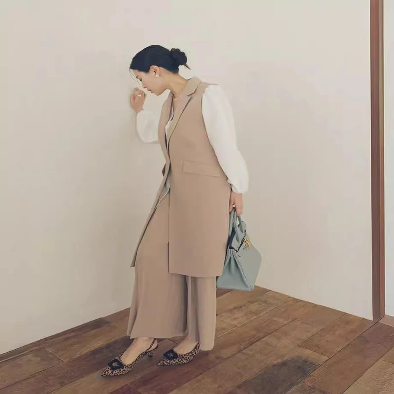 Damen Ärmellose Longweste im Tailoring mit Pattentaschen und einreihiger Knopfleiste Nord Taschen