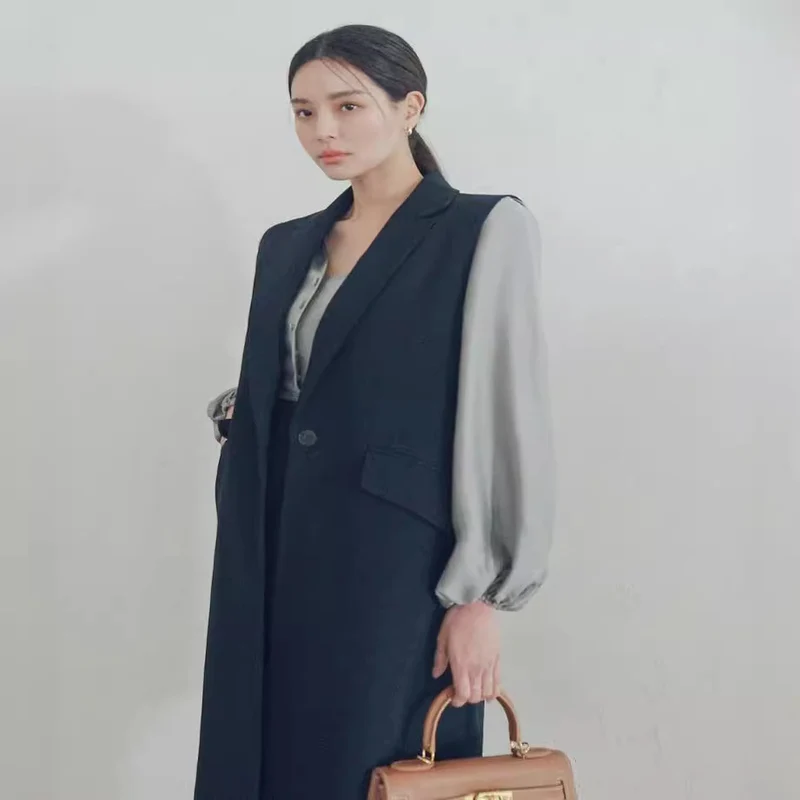 Damen Ärmellose Longweste im Tailoring mit Pattentaschen und einreihiger Knopfleiste Nord Taschen