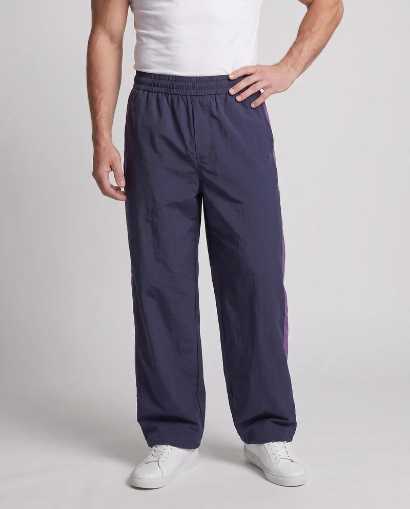Herren Weite Nylon-Trainingshose im Retro-Sportstil mit elastischem Bund, Tunnelzug & Kontrast-Einsätzen Nord Taschen