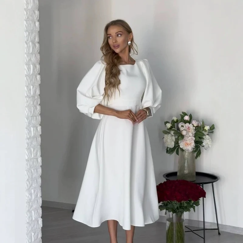 Damen Midikleid mit offenem Rückenausschnitt, voluminösen Puffärmeln und Bindegürtel Nord Taschen