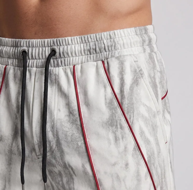 Unisex Weite Trackhose im Marmor-Look mit Tunnelzugbund & verstellbarem Saum