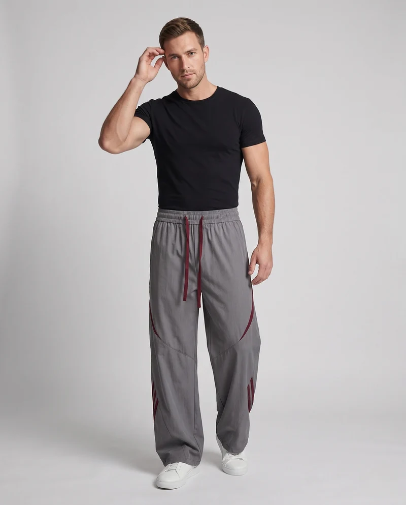 Herren Extra Breite Nylon Jogginghosen im Baggy-Schnitt mit Kordelzug, dekorativen Paneelen und seitlichen Kontraststreifen Nord Taschen