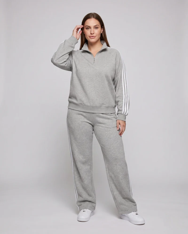 Unisex Oversize-Trainingsset aus French-Terry mit Halbzip, Raglanärmeln & weiten Seitenstreifen-Jogginghose