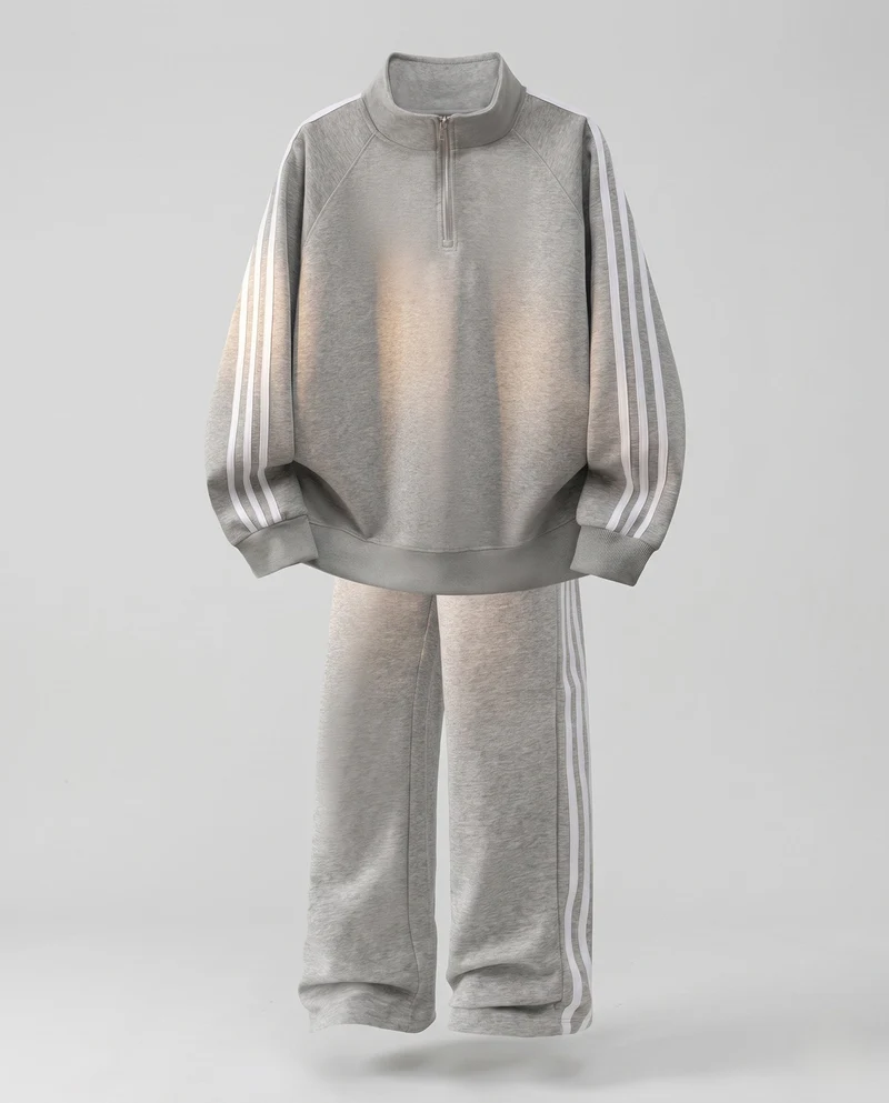 Unisex Oversize-Trainingsset aus French-Terry mit Halbzip, Raglanärmeln & weiten Seitenstreifen-Jogginghose