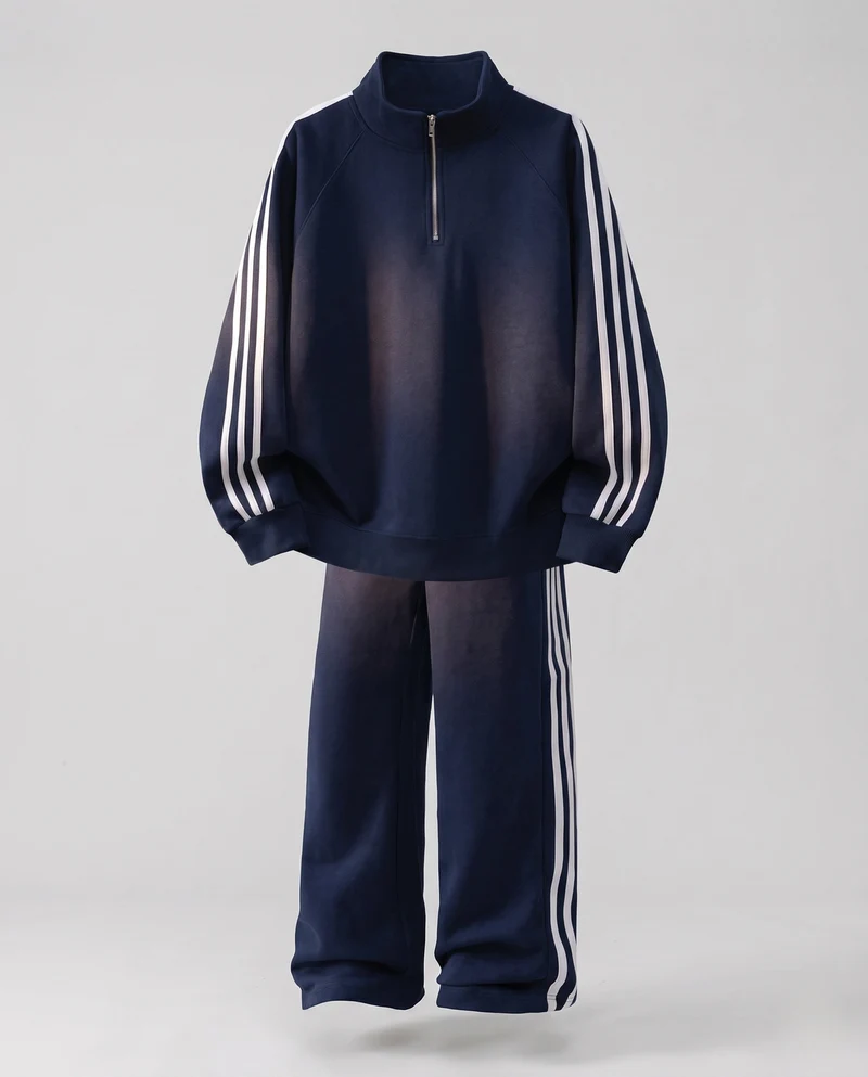 Unisex Oversize-Trainingsset aus French-Terry mit Halbzip, Raglanärmeln & weiten Seitenstreifen-Jogginghose