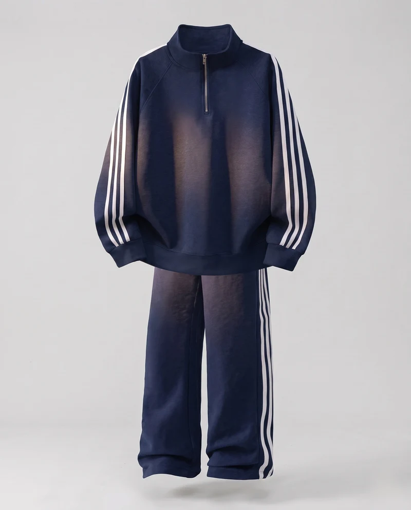 Unisex Oversize-Trainingsset aus French-Terry mit Halbzip, Raglanärmeln & weiten Seitenstreifen-Jogginghose