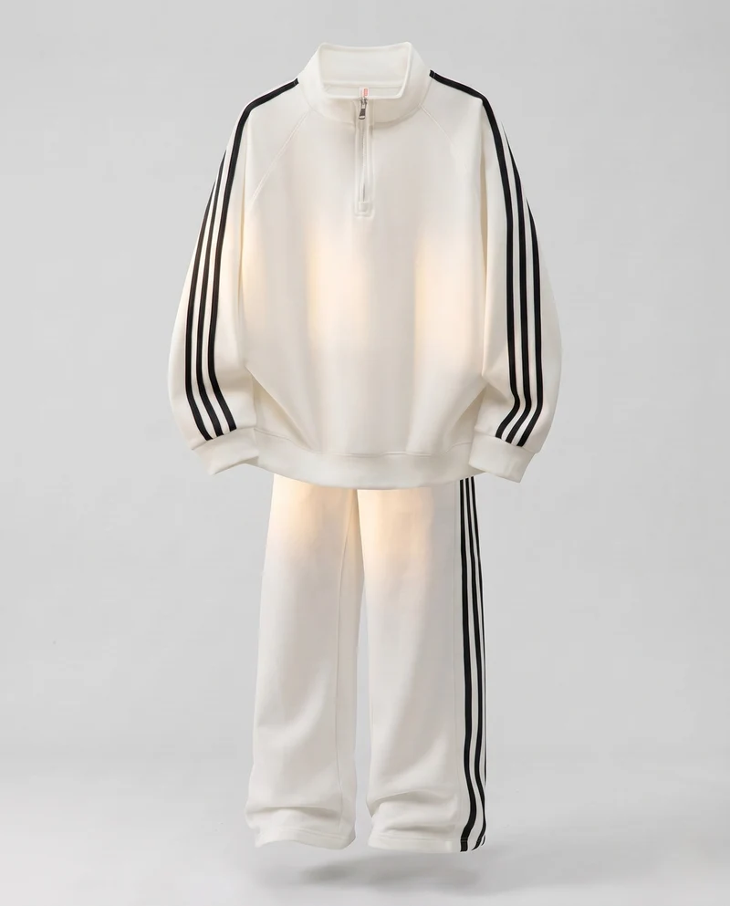 Unisex Oversize-Trainingsset aus French-Terry mit Halbzip, Raglanärmeln & weiten Seitenstreifen-Jogginghose