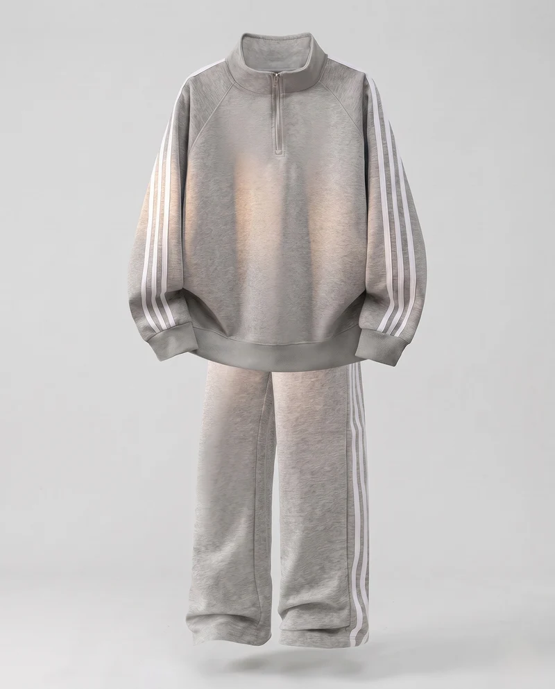 Unisex Oversize-Trainingsset aus French-Terry mit Halbzip, Raglanärmeln & weiten Seitenstreifen-Jogginghose