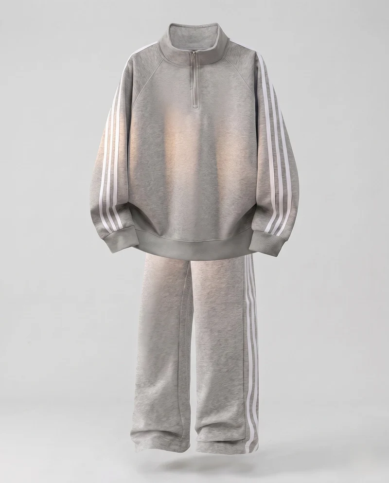 Unisex Oversize-Trainingsset aus French-Terry mit Halbzip, Raglanärmeln & weiten Seitenstreifen-Jogginghose