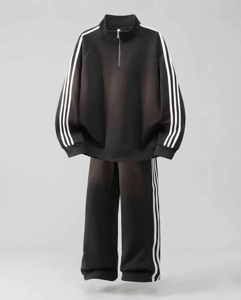 Unisex Oversize-Trainingsset aus French-Terry mit Halbzip, Raglanärmeln & weiten Seitenstreifen-Jogginghose