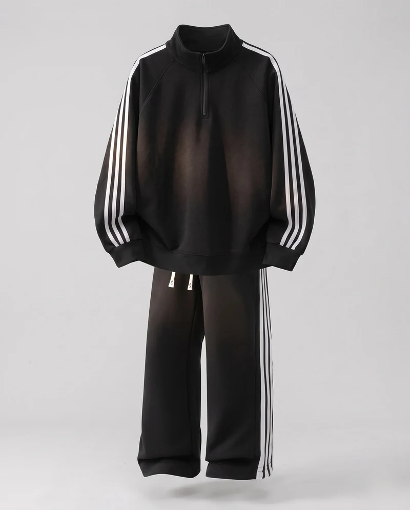 Unisex Oversize-Trainingsset aus French-Terry mit Halbzip, Raglanärmeln & weiten Seitenstreifen-Jogginghose