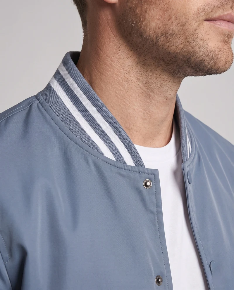 Leichte Nylon Varsity Bomberjacke für Herren mit gestreiften Rippbündchen Nord Taschen