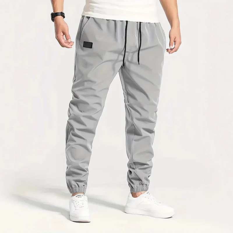 Herren Technische Jogginghose im Tapered‑Utility‑Stil mit elastischem Bund & Knöchelbündchen Nord Taschen
