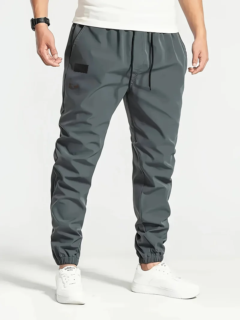 Herren Technische Jogginghose im Tapered‑Utility‑Stil mit elastischem Bund & Knöchelbündchen Nord Taschen