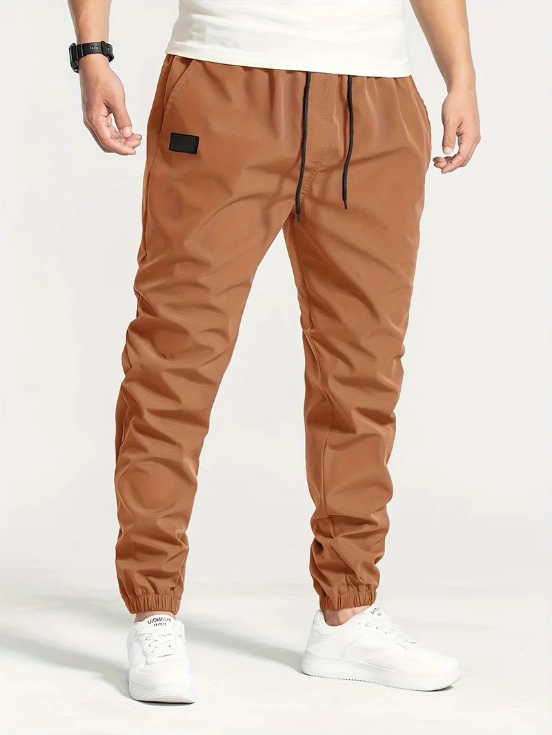 Herren Technische Jogginghose im Tapered‑Utility‑Stil mit elastischem Bund & Knöchelbündchen Nord Taschen