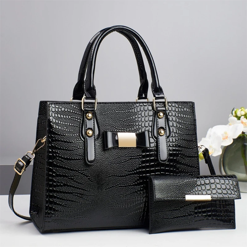 Damen elegante Handtasche mit schicker Schleifenapplikation und edlem Krokodil-Look Nord Taschen