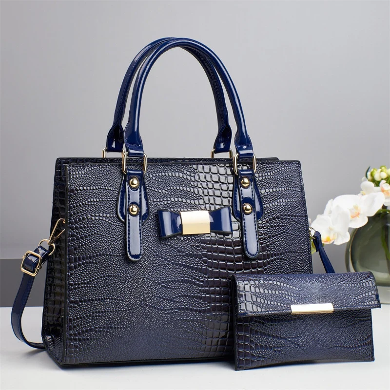 Damen elegante Handtasche mit schicker Schleifenapplikation und edlem Krokodil-Look Nord Taschen
