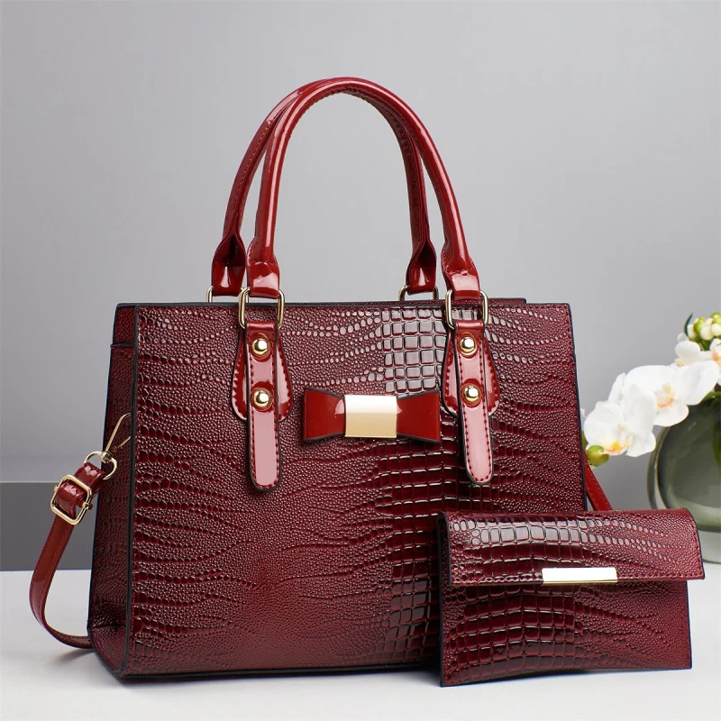 Damen elegante Handtasche mit schicker Schleifenapplikation und edlem Krokodil-Look Nord Taschen