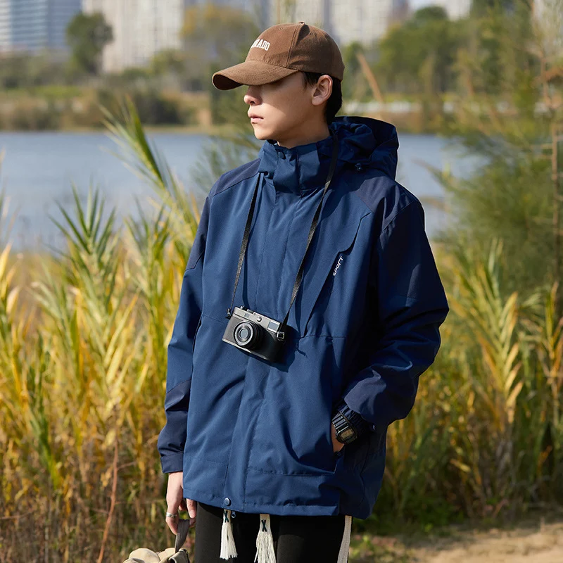 Damen zweilagige wasserabweisende Outdoorjacke mit Kapuze, Taillenregulierung und Kontrastbesätzen Nord Taschen