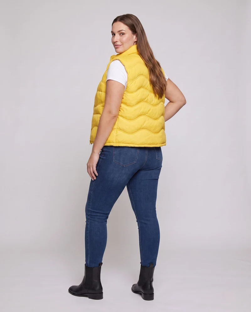 Damen ärmellose thermo gesteppte Weste mit ergonomischer Wellensteppung, hohem Kragen und verstellbarem Kordelzugsaum