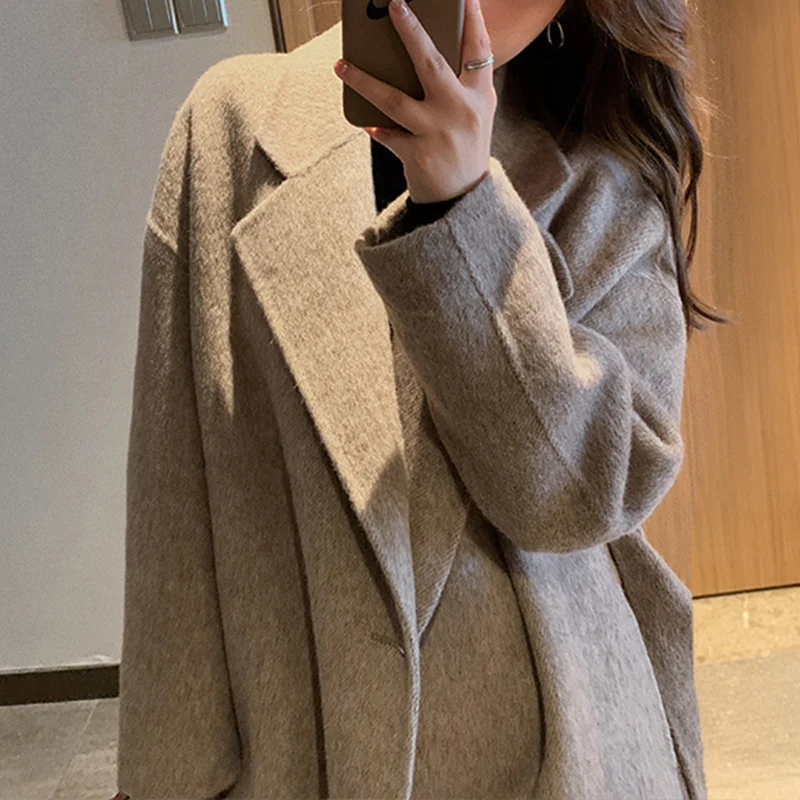 Damen Elegante und lässige Oversized-Wolljacke Nord Taschen