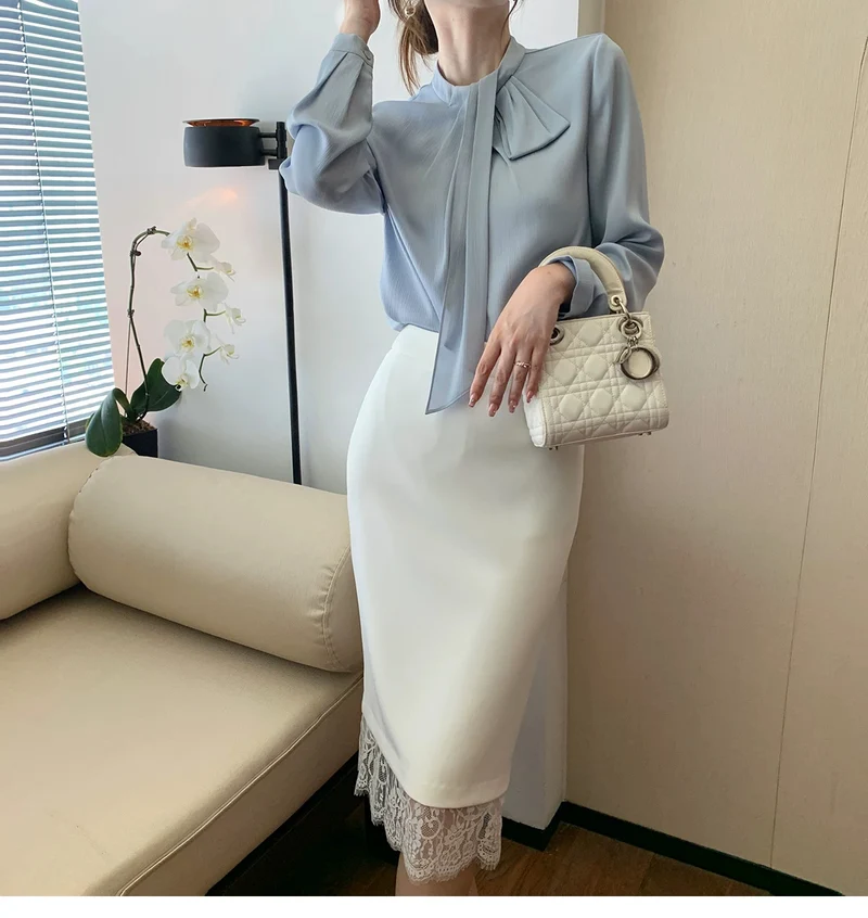Damen Elegante und figurbetonte Bluse mit Schleifendetail Nord Taschen