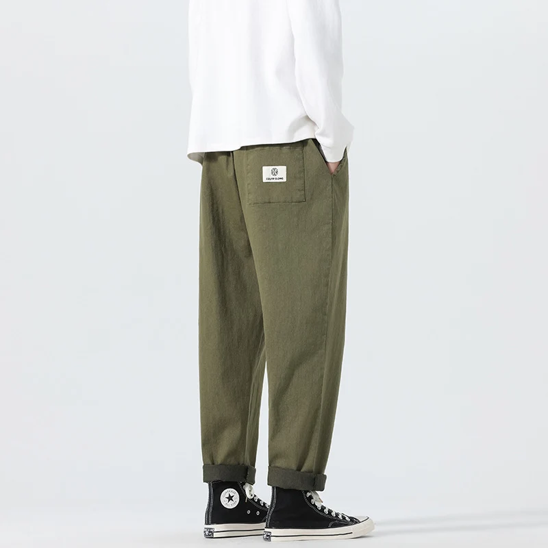Herren Locker geschnittene Cropped-Denimhose mit Umschlag und Label-Patch Nord Taschen
