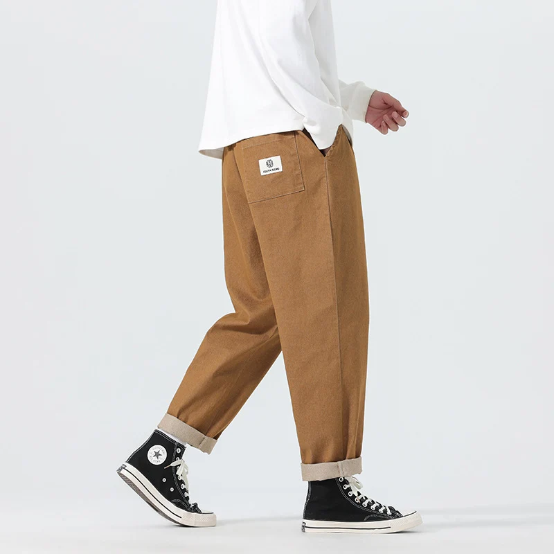 Herren Locker geschnittene Cropped-Denimhose mit Umschlag und Label-Patch Nord Taschen