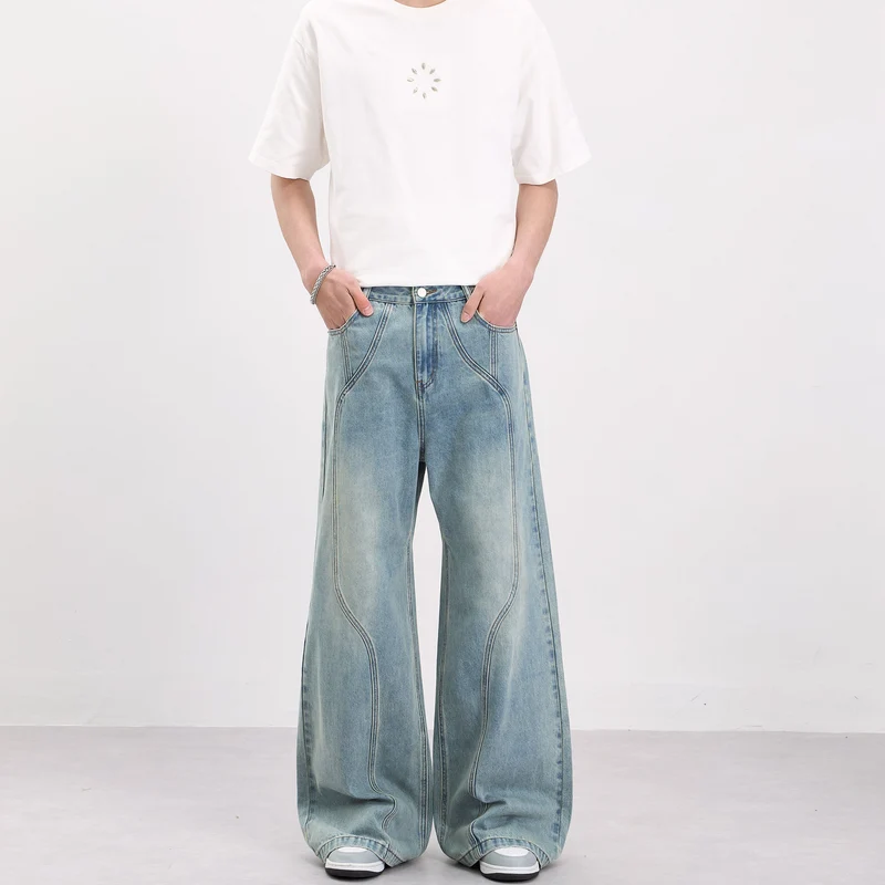 Herren Weit geschnittene Denim-Palazzohose mit geschwungenen Nahtpaneelen und extralangem Saum Nord Taschen